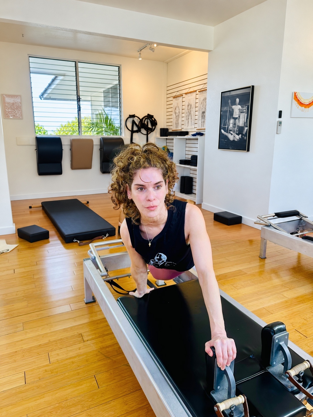 Anat practising on the reformer at PilateStory